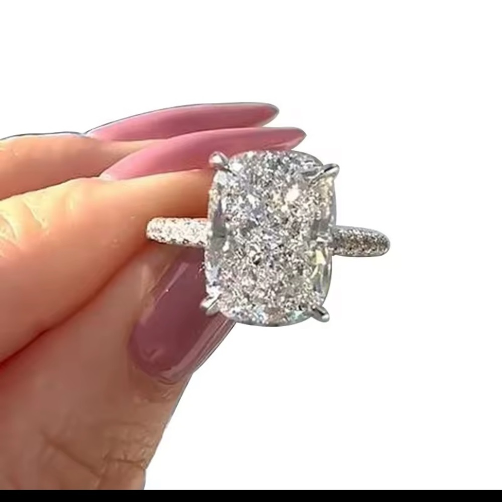 4 CTs Sparkling Oval Moissanite Ring in White Gold